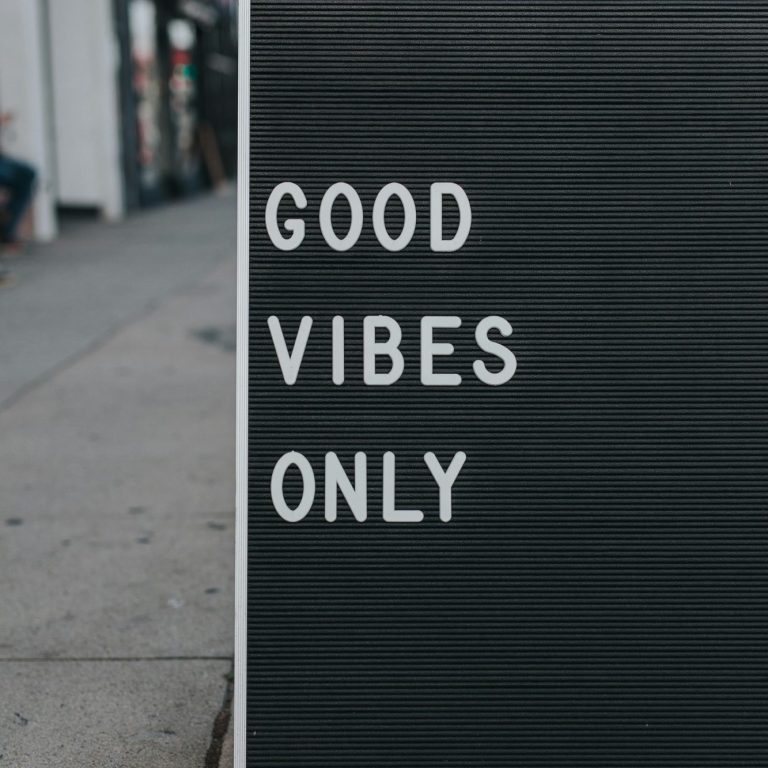 Sign with the words "Good Vibes Only" displayed prominently on a dark background.